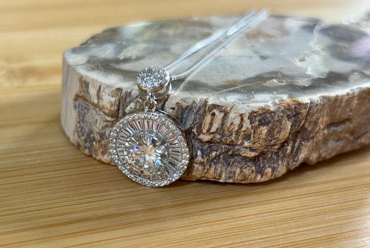 Moissanite necklace. The certified 2ct Moissanite “Sunburst” necklace with a 61 gemstone pendant plus more in the bail! Radiantly beautiful!