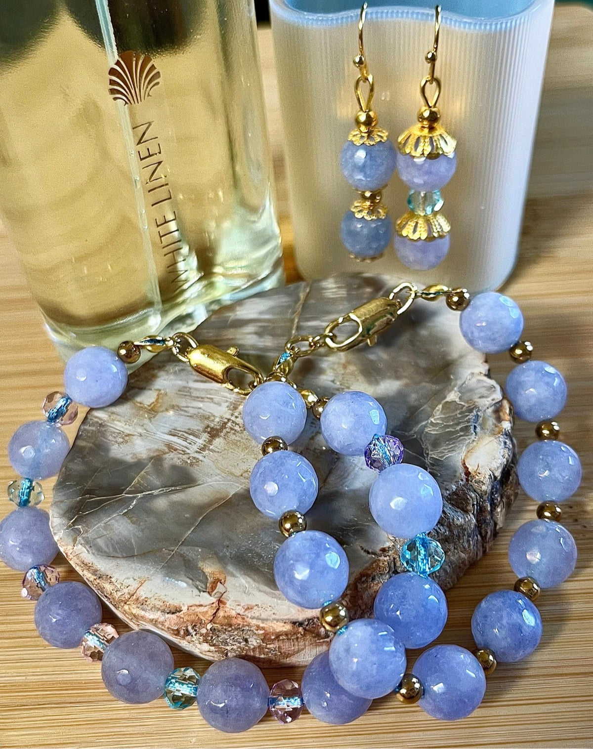 Aquamarine bracelets and/or earrings. Faceted 10mm aquamarines with your choice of crystal or stainless steel station beads and stainless steel color!