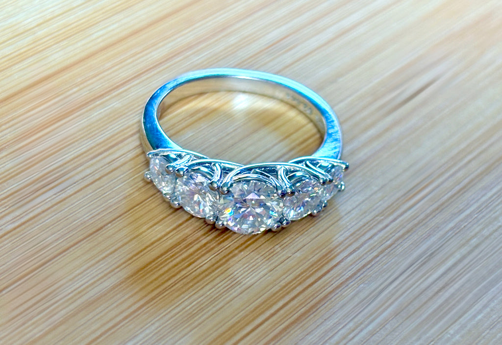 Moissanite ring. A 2.5ctw certified Moissanite ring, for those who want plenty of sparkle but a daintier ring! This feminine 5-stone design is just the thing!