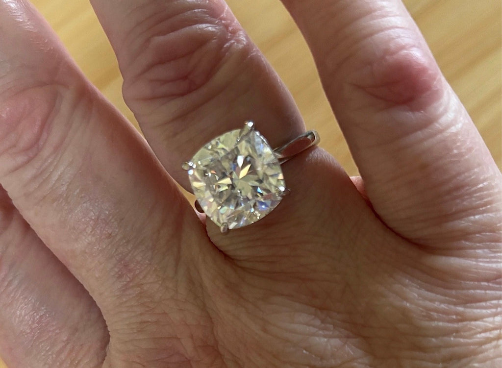 A fiery 9ct certified CLASSIC cushion-cut Moissanite solitaire, the ring of a certain princess (ex-princess?), but without the royal price tag! So indulge!