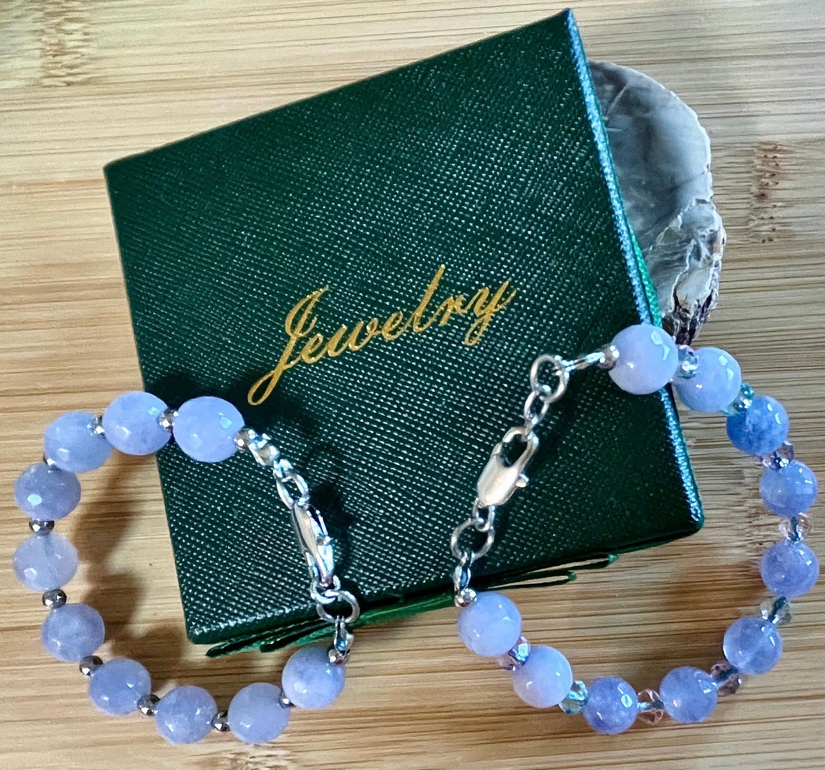 Aquamarine bracelets and/or earrings. Faceted 10mm aquamarines with your choice of crystal or stainless steel station beads and stainless steel color!