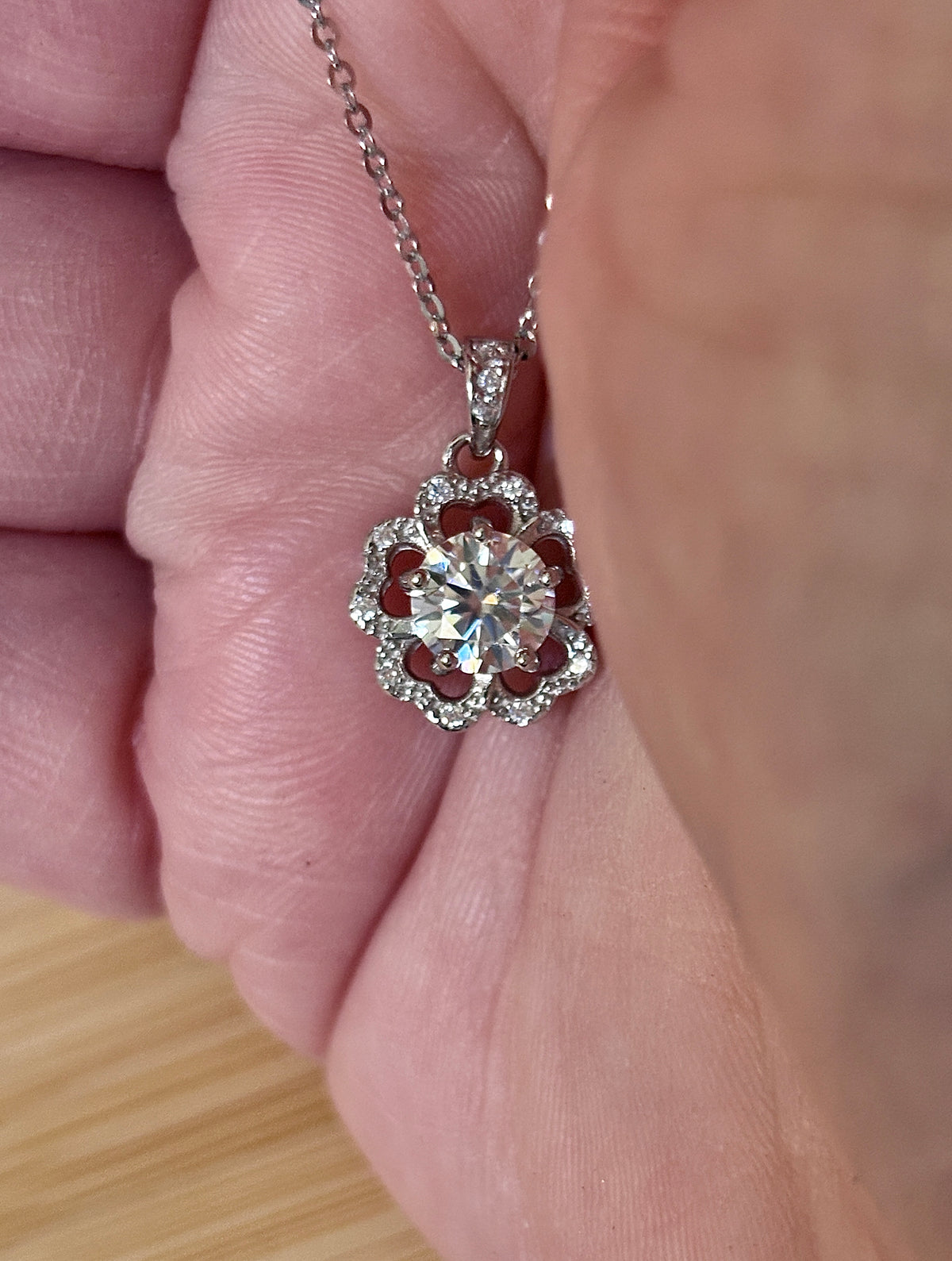 Moissanite necklace. A certified 1ct Moissanite hibiscus necklace with white zircon accents in solid sterling and white rhodium!