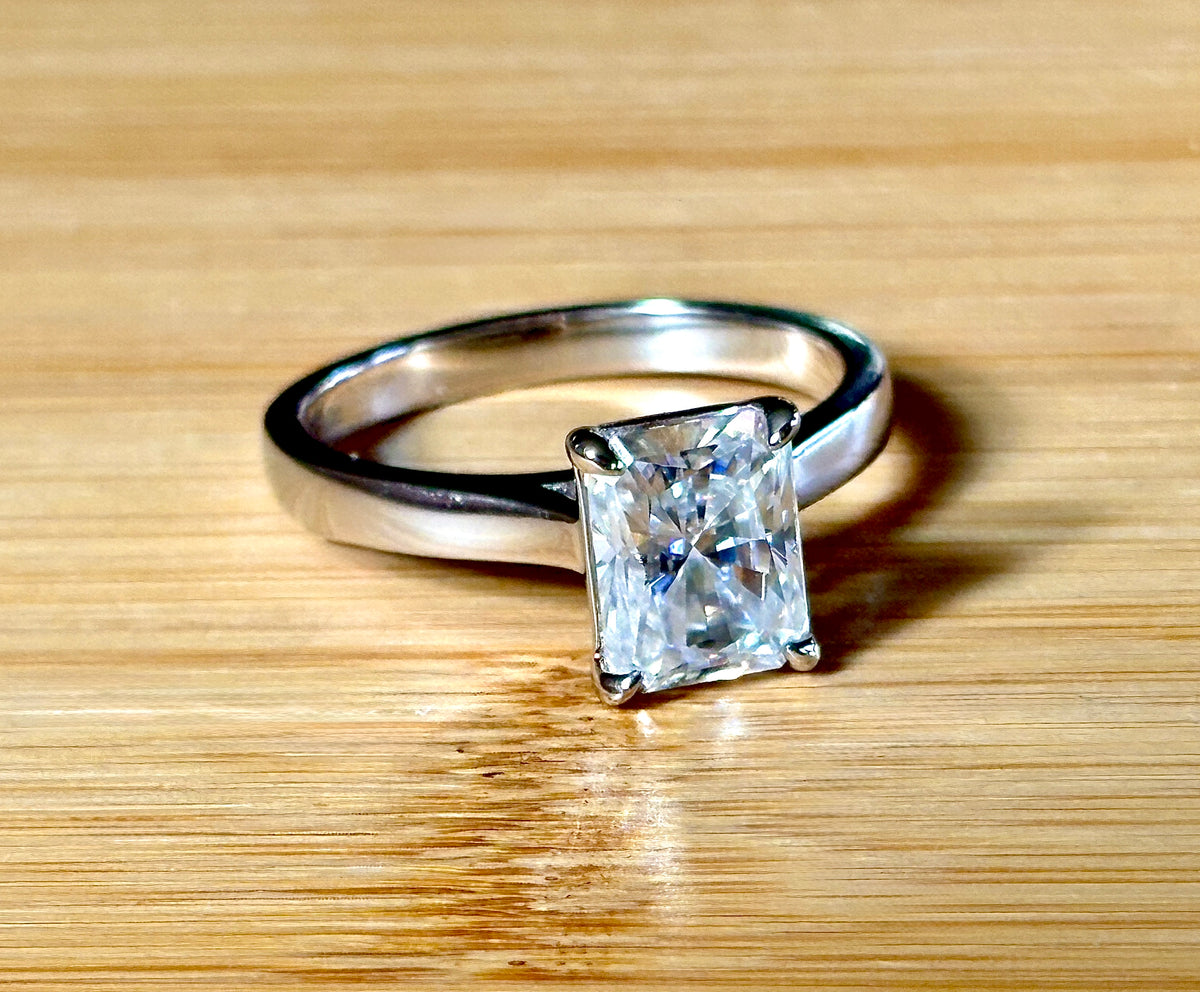 A certified Moissanite 3ct radiant solitaire! An UBER flashy, ULTRA classy, contemporary and chic radiant-cut engagement ring!