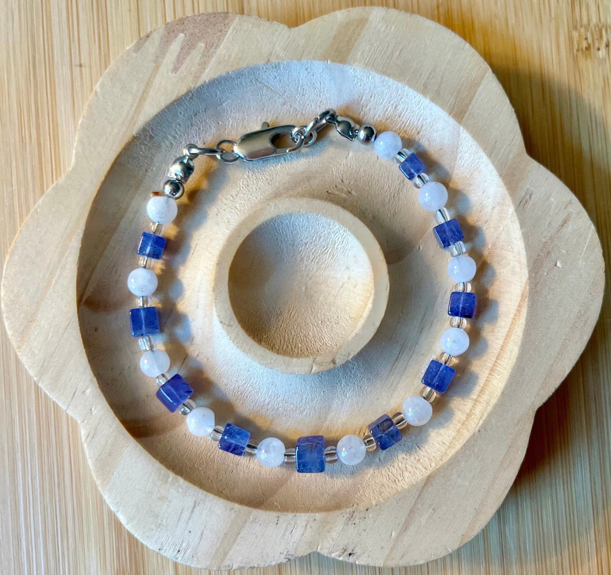 Moonstone and tanzanite bracelet. Dusky tanzanite cubes and round moonstones on stainless steel jeweler’s wire! Pretty and petite!