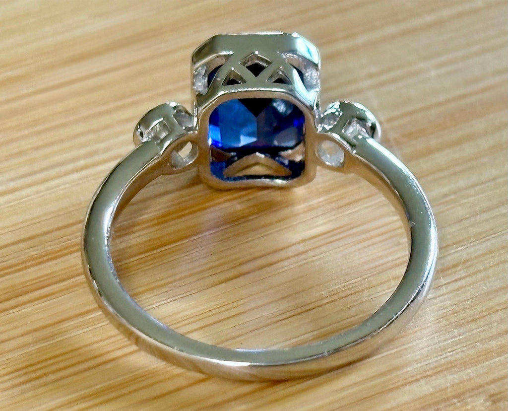 Blue sapphire and Moissanite ring. A certified 3ct lab-grown emerald-cut sapphire and .20ctw Moissanite ring in 925 sterling OR 935 Argentium!