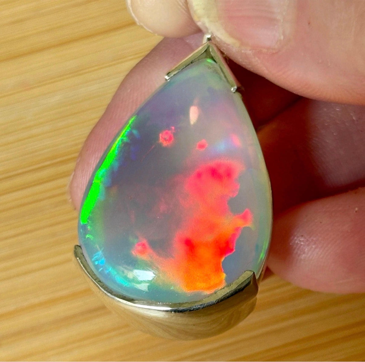 The “After the Storm” Ethiopian opal pendant, 39.18ct with rare “rolling” fire and spectacular play of color! **Collector’s grade** AAAA++