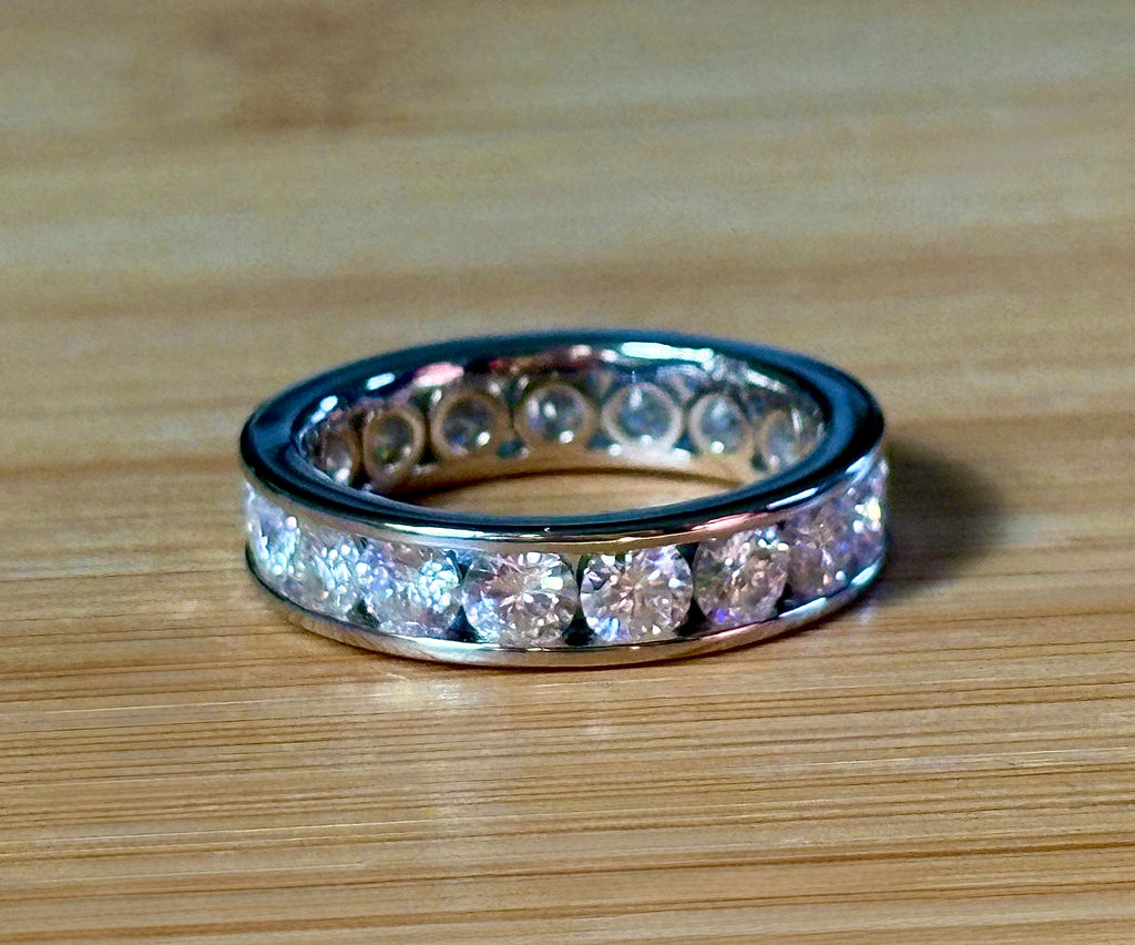 Moissanite ring. A 5.10cttw or 4.8cttw (depending on size) Moissanite eternity ring. A channel-set, classy and classic design - beautiful!