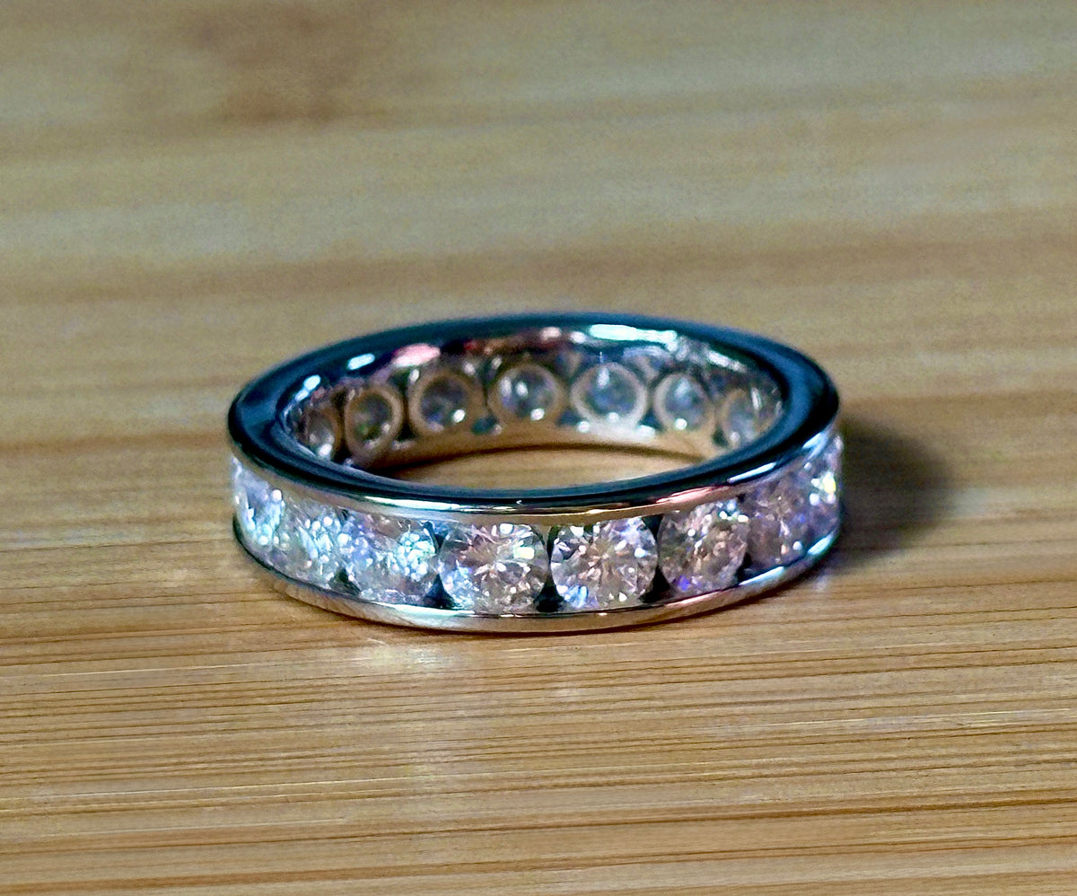 Moissanite ring. A 5.10cttw or 4.8cttw (depending on size) Moissanite eternity ring. A channel-set, classy and classic design - beautiful!
