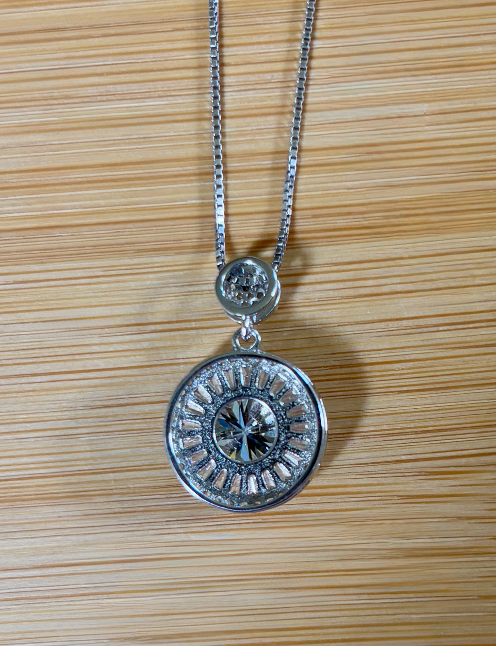 Moissanite necklace. The certified 2ct Moissanite “Sunburst” necklace with a 61 gemstone pendant plus more in the bail! Radiantly beautiful!