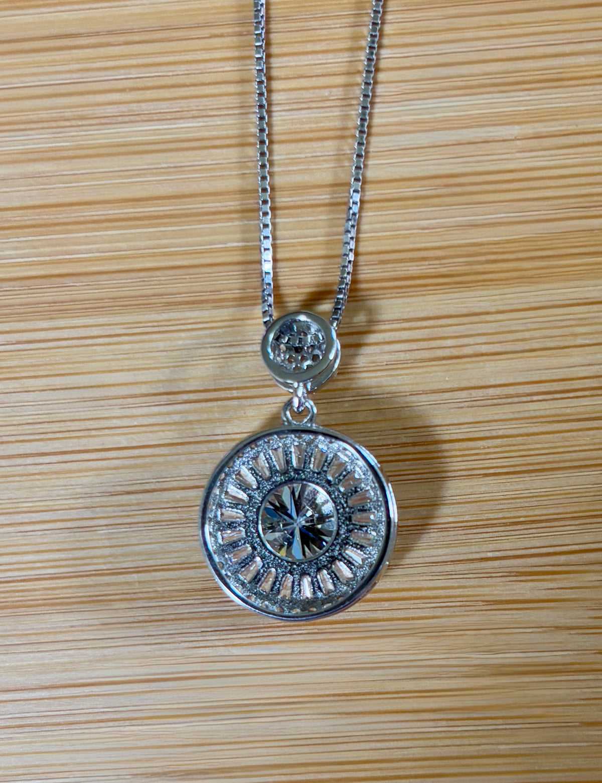 Moissanite necklace. The certified 2ct Moissanite “Sunburst” necklace with a 61 gemstone pendant plus more in the bail! Radiantly beautiful!