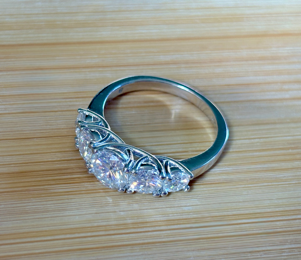 Moissanite ring. A 2.5ctw certified Moissanite ring, for those who want plenty of sparkle but a daintier ring! This feminine 5-stone design is just the thing!
