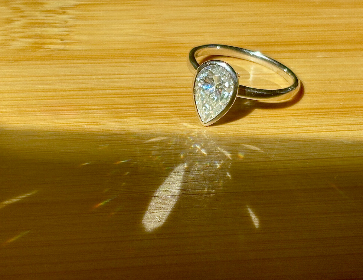 Moissanite ring. A certified 3ct pear in a hybrid basket + bezel of 925 sterling or 935 Argentium silver! A Hand Knotted Jewelry EXCLUSIVE!