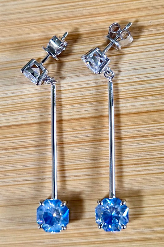 8ctw Moissanite pendulum earrings, with 3ct octagonal frosty aquamarine Moissanites at the bottom of the pendulum, and 1ct white round brilliant Moissanites at the top! Full Argentium silver construction with sterling silver disk backs! An HKJ exclusive!