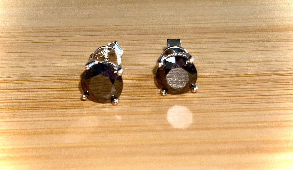 Moissanite studs. A 2cttw certified pair of black Moissanite studs in a sterling silver basket setting with 18k white gold plating!