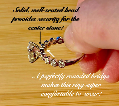 A 3.8cttw designer Moissanite ring with a certified 3ct center stone and 10-point bezel-set stones in sterling silver and 18k gold!