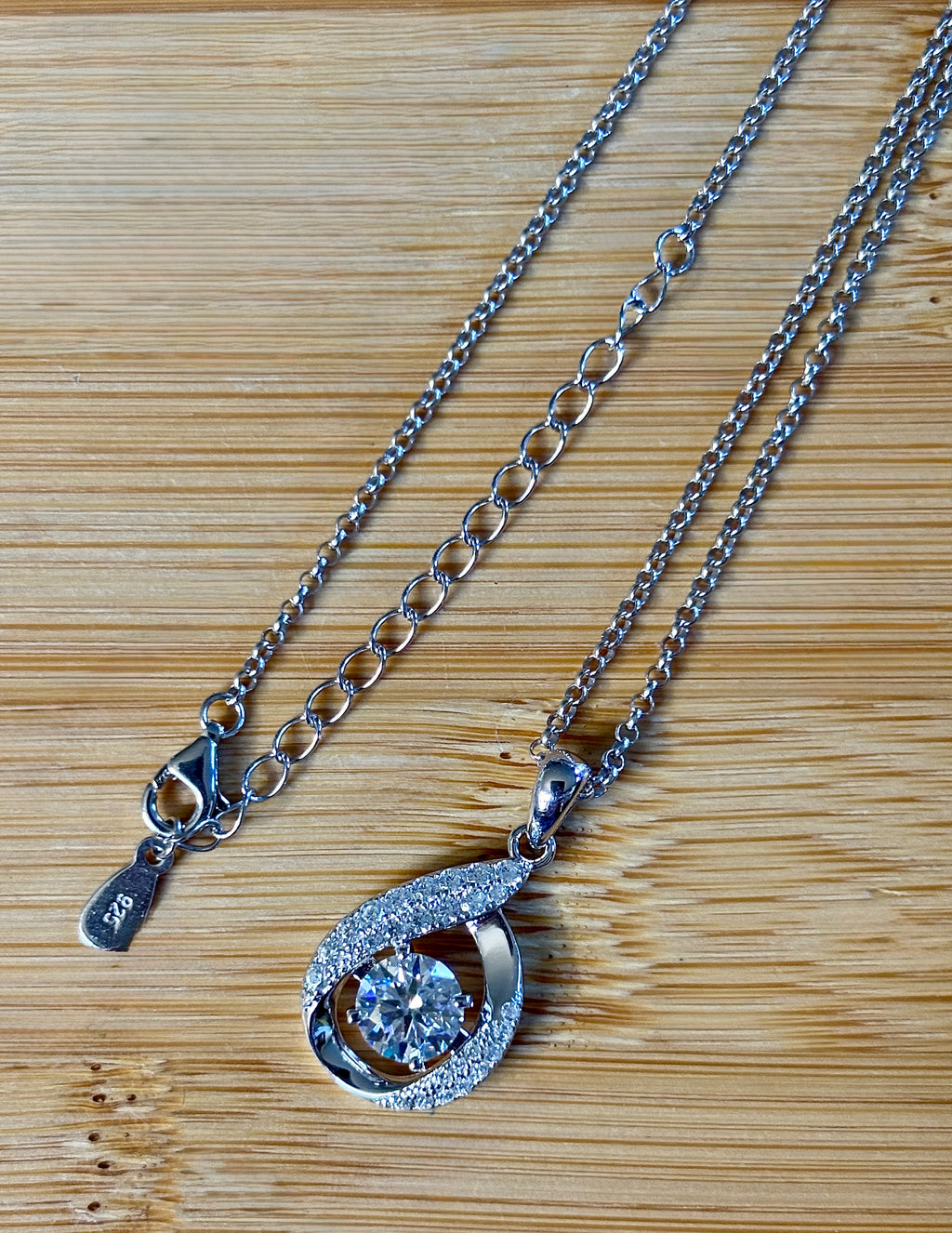 Moissanite necklace. A 1ct 8H8A certified Moissanite water drop-shaped pendant with white zircons, on a nicely weighted rolo chain with lobster claw clasp!
