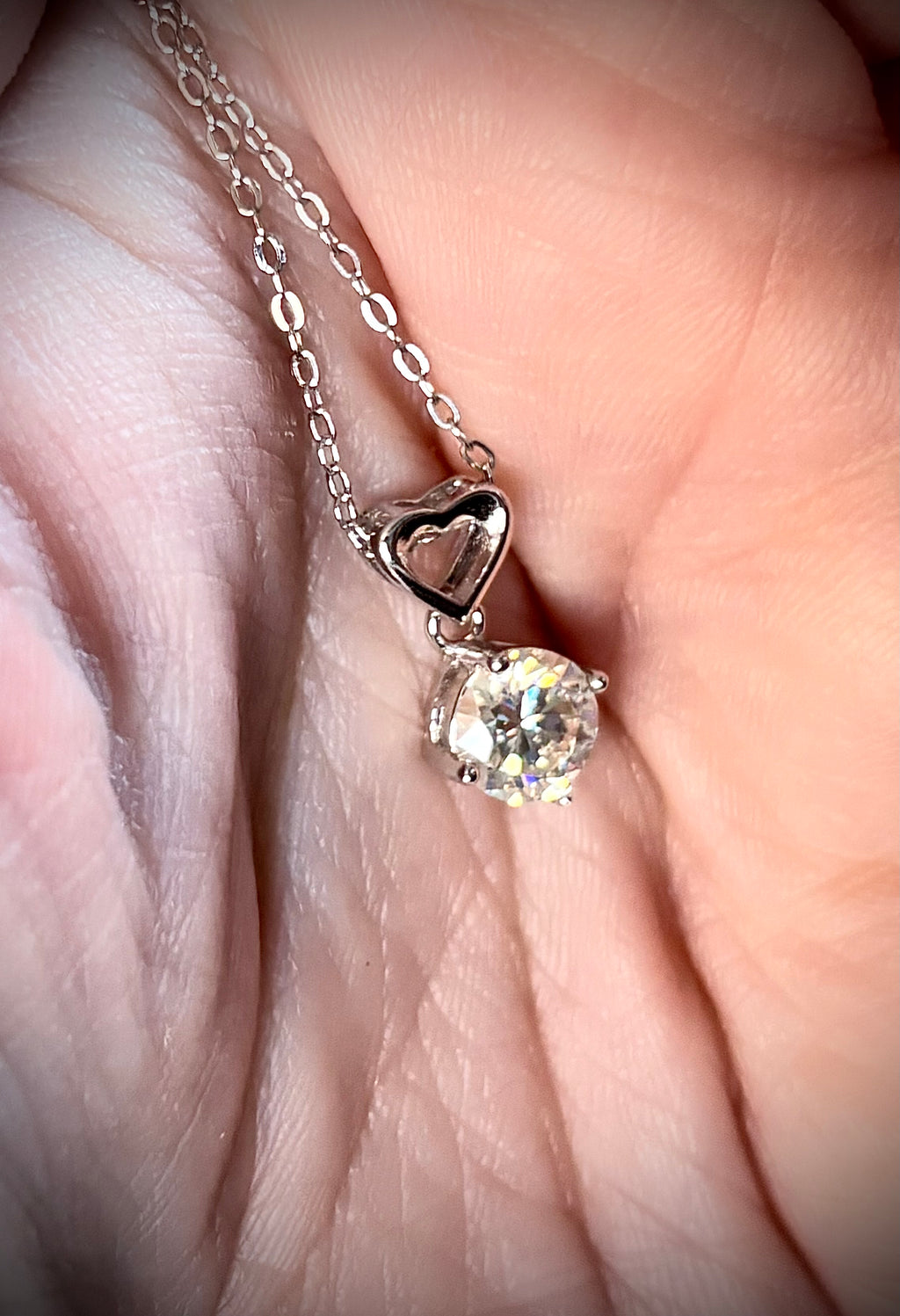 Moissanite necklace. A romantic heart-shaped pendant featuring a certified 1ct round WHITE or BLUE round brilliant Moissanite in sterling silver!