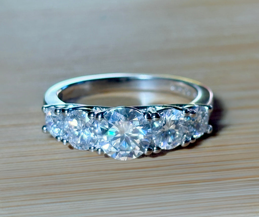 Moissanite ring. A 2.5ctw certified Moissanite ring, for those who want plenty of sparkle but a daintier ring! This feminine 5-stone design is just the thing!