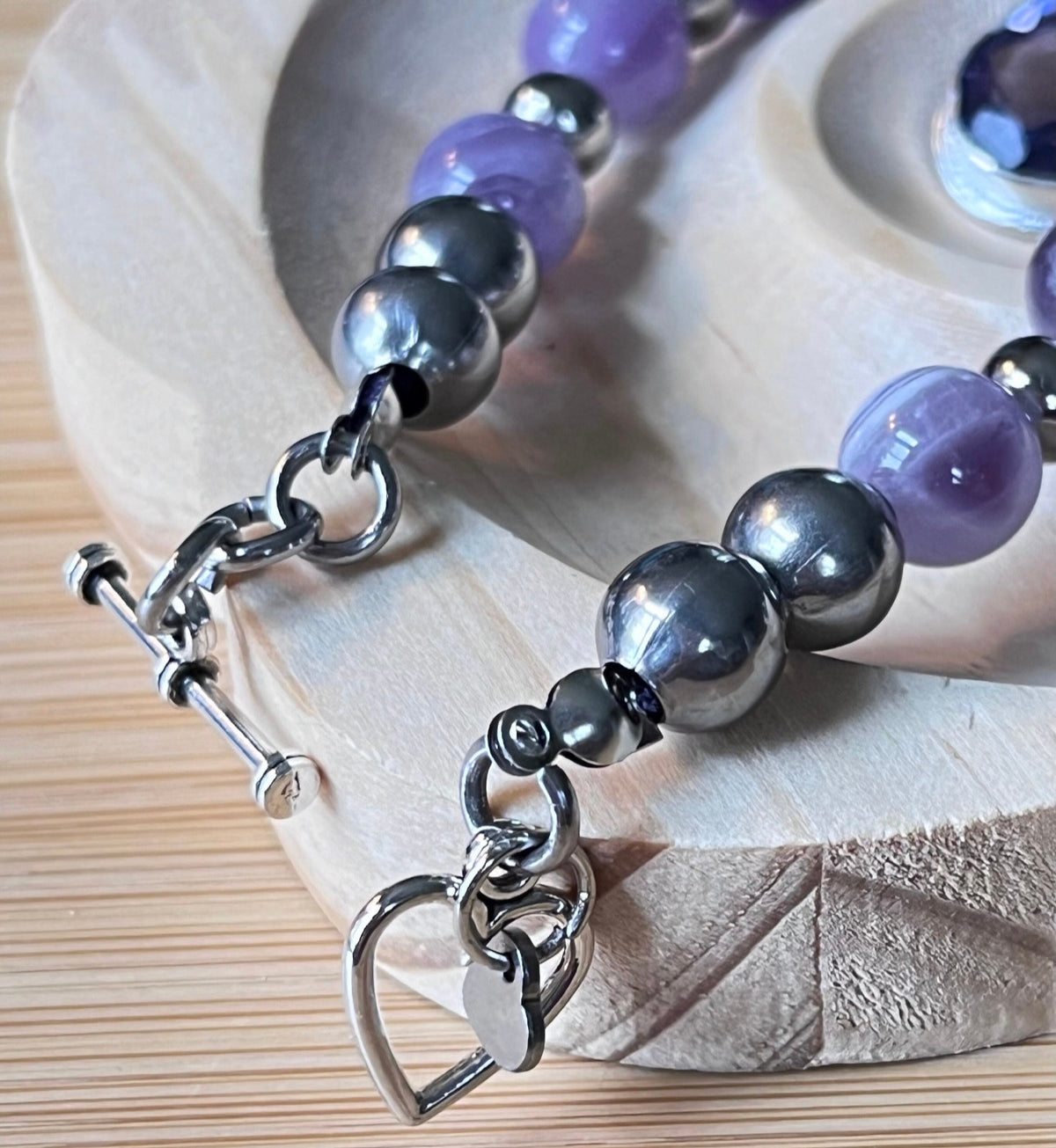 Amethyst bracelet. Pretty purple amethysts with chevron pattern crystallization! 8mm beads with durable stainless steel bracelet hardware!