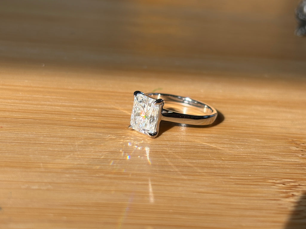 A certified Moissanite 3ct radiant solitaire! An UBER flashy, ULTRA classy, contemporary and chic radiant-cut engagement ring!
