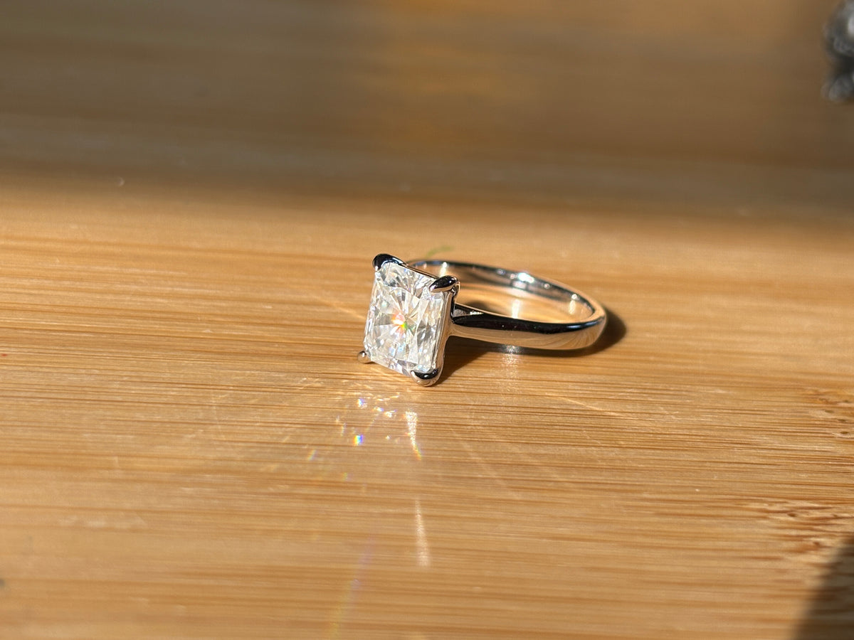 A certified Moissanite 3ct radiant solitaire! An UBER flashy, ULTRA classy, contemporary and chic radiant-cut engagement ring!