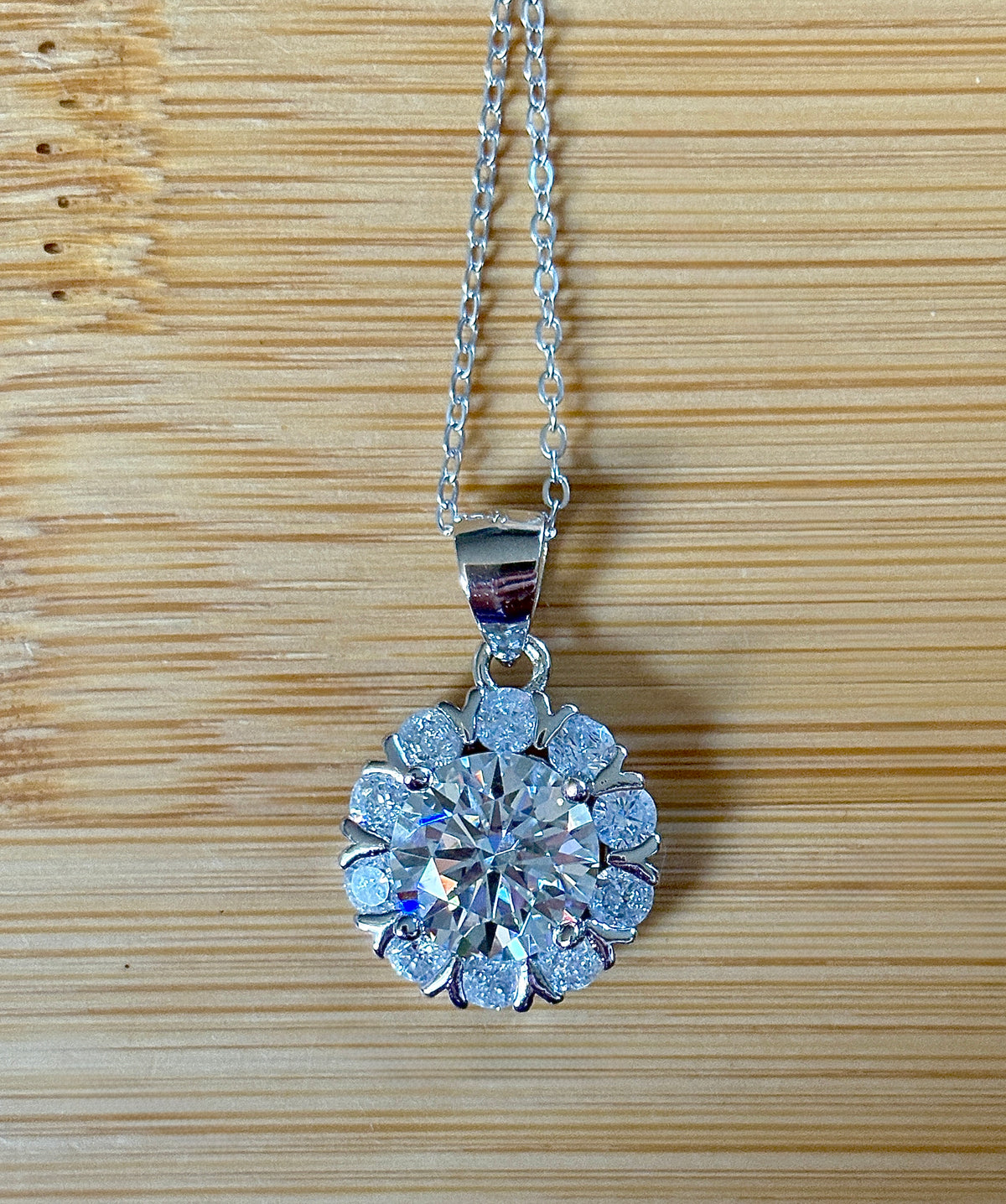 Moissanite necklace. A 3ct certified round brilliant Moissanite in a snowflake-shaped pendant ! A perfect piece for the holidays and beyond!