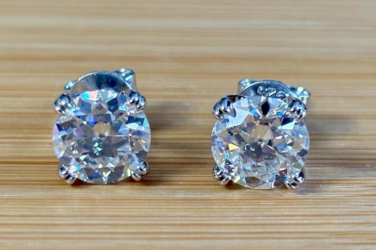 A lovely DOUBLE certified pair of 4cttw Old European Cut Moissanite studs in 935 Argentium silver and 18k double-claw mountings!