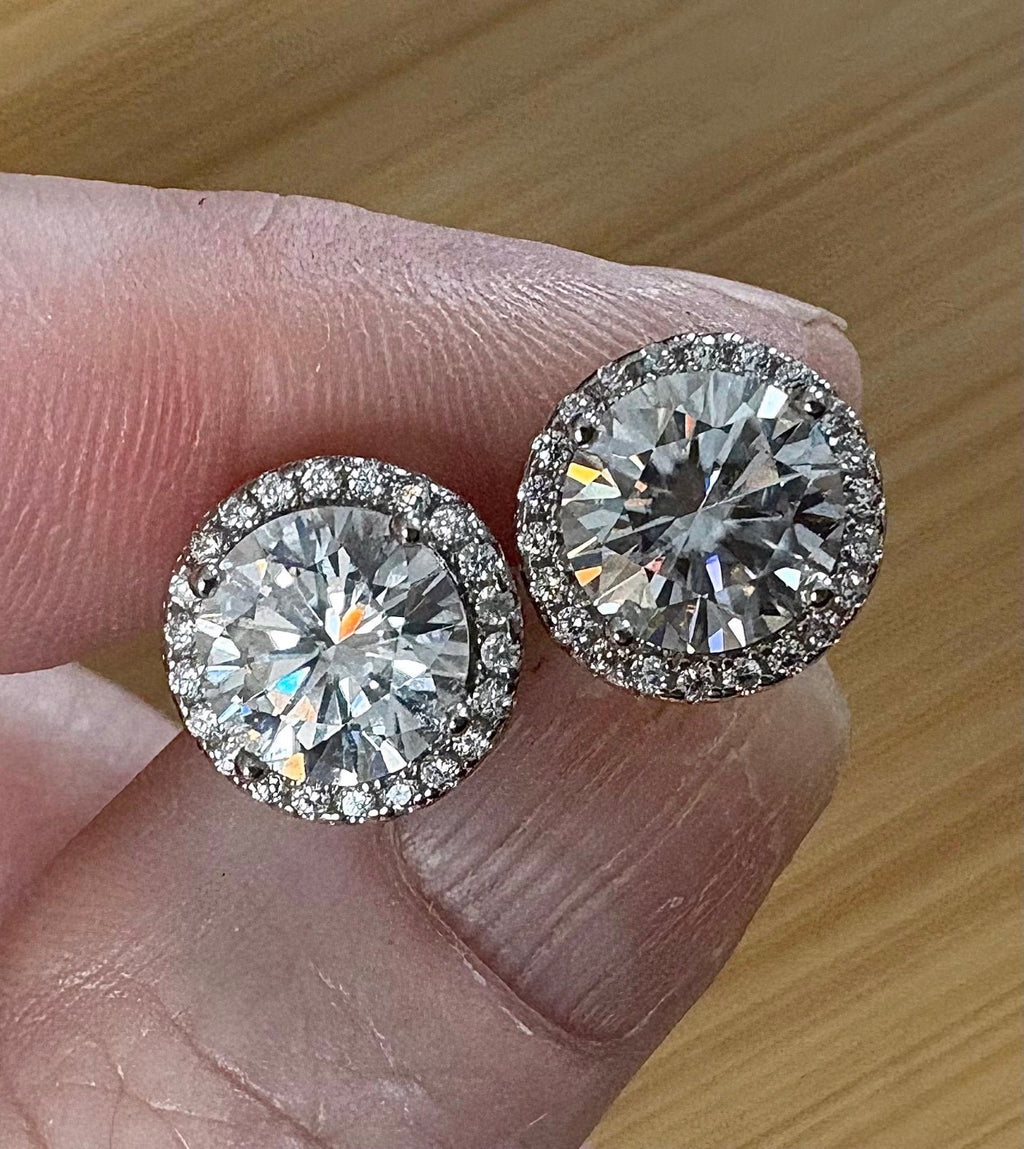Moissanite earrings. A glittering 5.44cttw pair of certified Moissanites and white zircons in 18k gold-embraced sterling silver! Perfection!