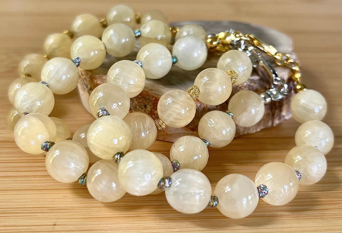 Silky yellow quartz bracelet. Chatoyant 10mm buttercream quartzite (AKA silk jade) hand-knotted bracelet with METALLIC string!