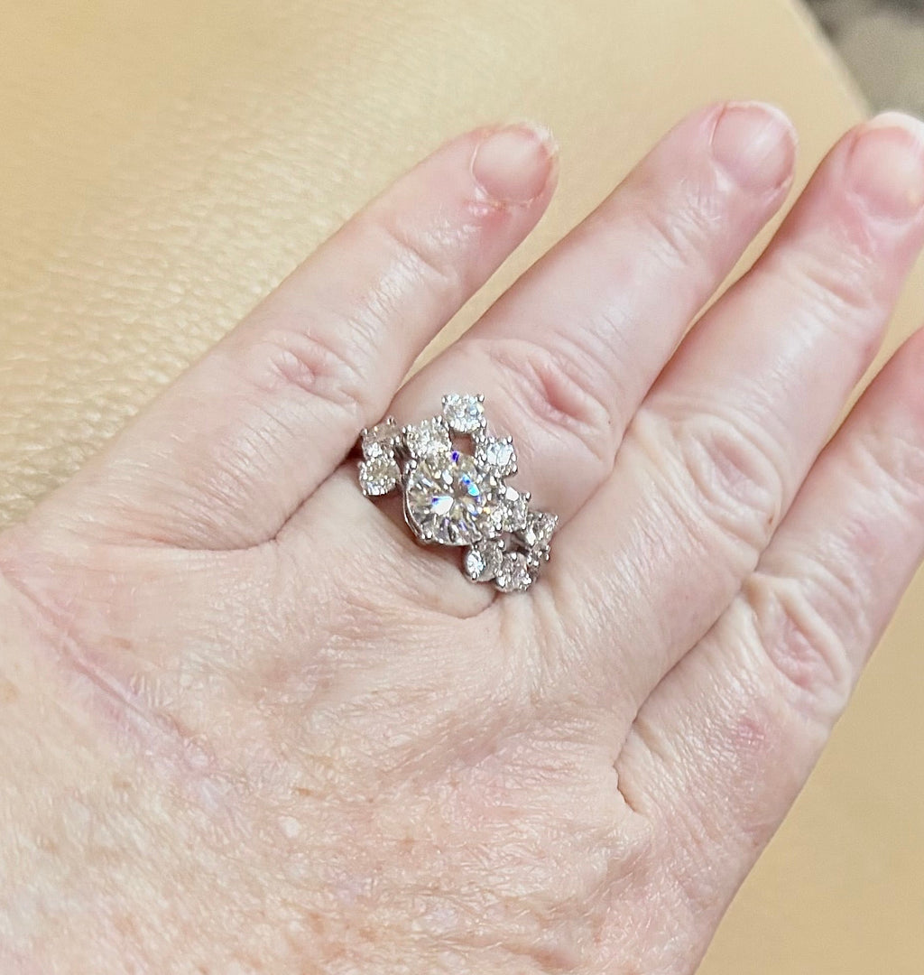 Moissanite ring. The “Moissanite Galaxy” ring features a 3ct certified Moissanite amid a 4cttw Moissanite constellation  - a 7cttw ring!