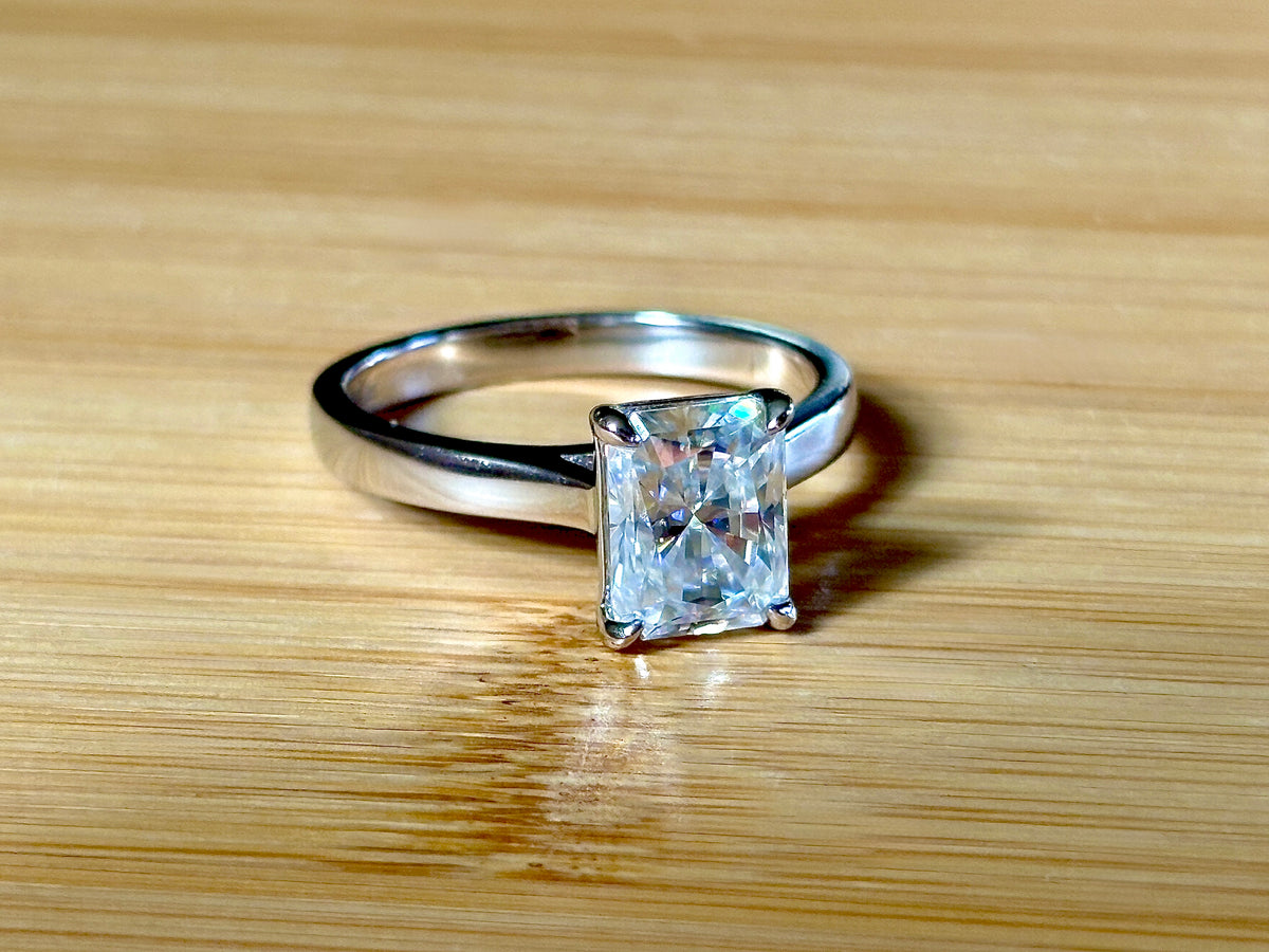 A certified Moissanite 3ct radiant solitaire! An UBER flashy, ULTRA classy, contemporary and chic radiant-cut engagement ring!