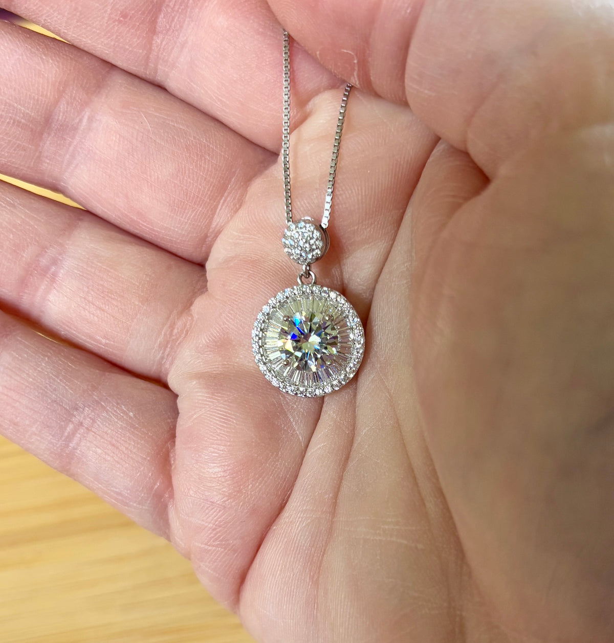Moissanite necklace. The certified 2ct Moissanite “Sunburst” necklace with a 61 gemstone pendant plus more in the bail! Radiantly beautiful!