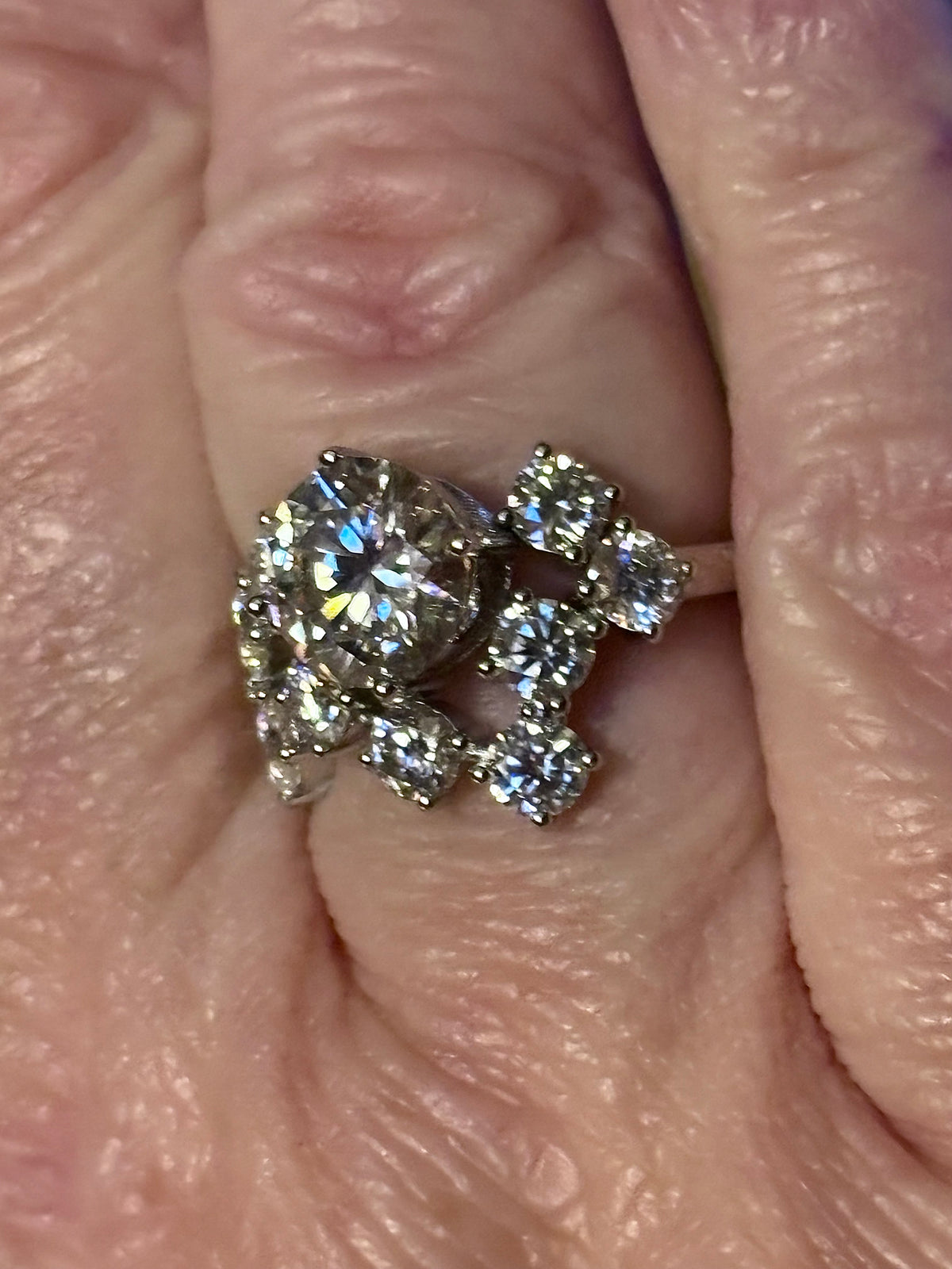 Moissanite ring. The “Moissanite Galaxy” ring features a 3ct certified Moissanite amid a 4cttw Moissanite constellation  - a 7cttw ring!