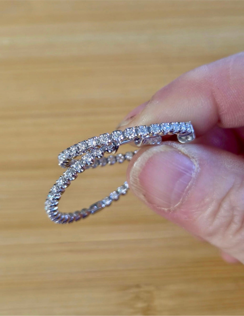 Moissanite hoops. These 1.8ctw Moissanite inside-out hoops *lock* in place so you can take your style from the office to the dance floor! So boogie down!