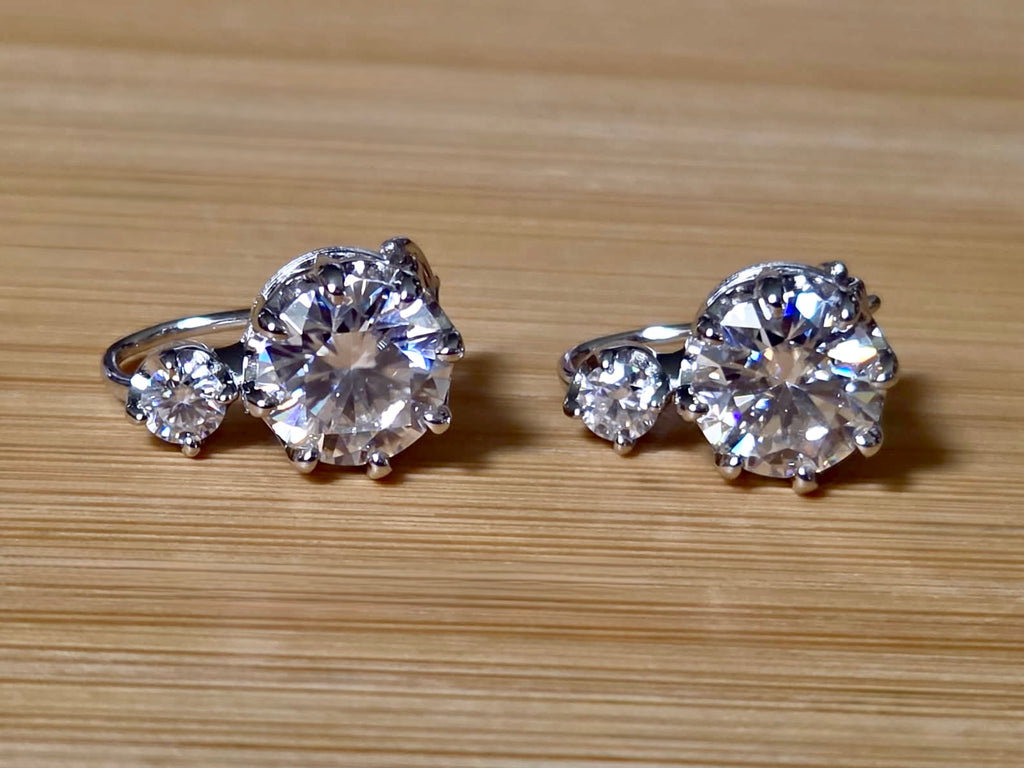 A Victorian inspired 4.2cttw certified pair of Moissanite 2-stone buckle back earrings in Argentium silver! Minimalist glam!