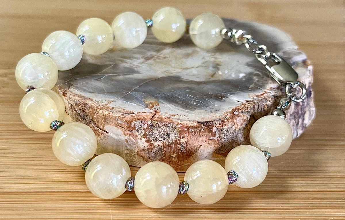 Silky yellow quartz bracelet. Chatoyant 10mm buttercream quartzite (AKA silk jade) hand-knotted bracelet with METALLIC string!