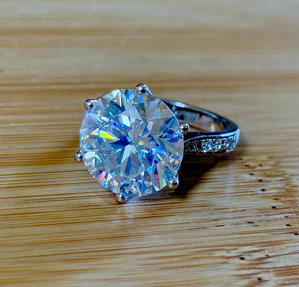 Moissanite ring. The 10ct certified 8H8A Moissanite “Tulip” statement ring with .50cttw Moissanite accents! Photos fail this GORGEOUS ring!