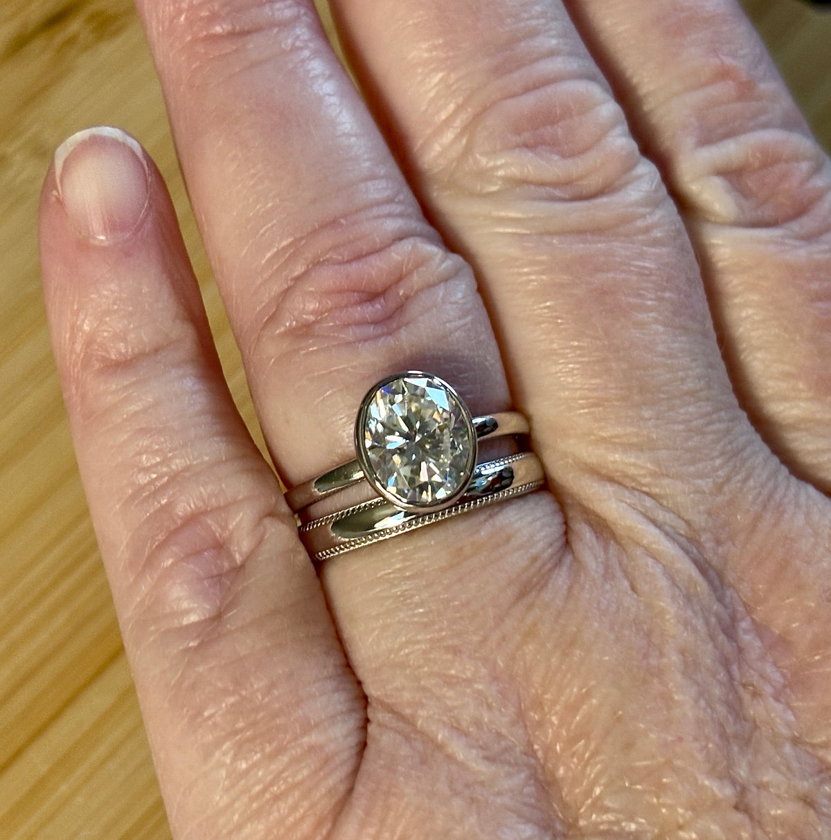 Moissanite ring. A 3ct oval in a hybrid basket + bezel of sterling OR Argentium silver! A Hand Knotted Jewelry EXCLUSIVE!