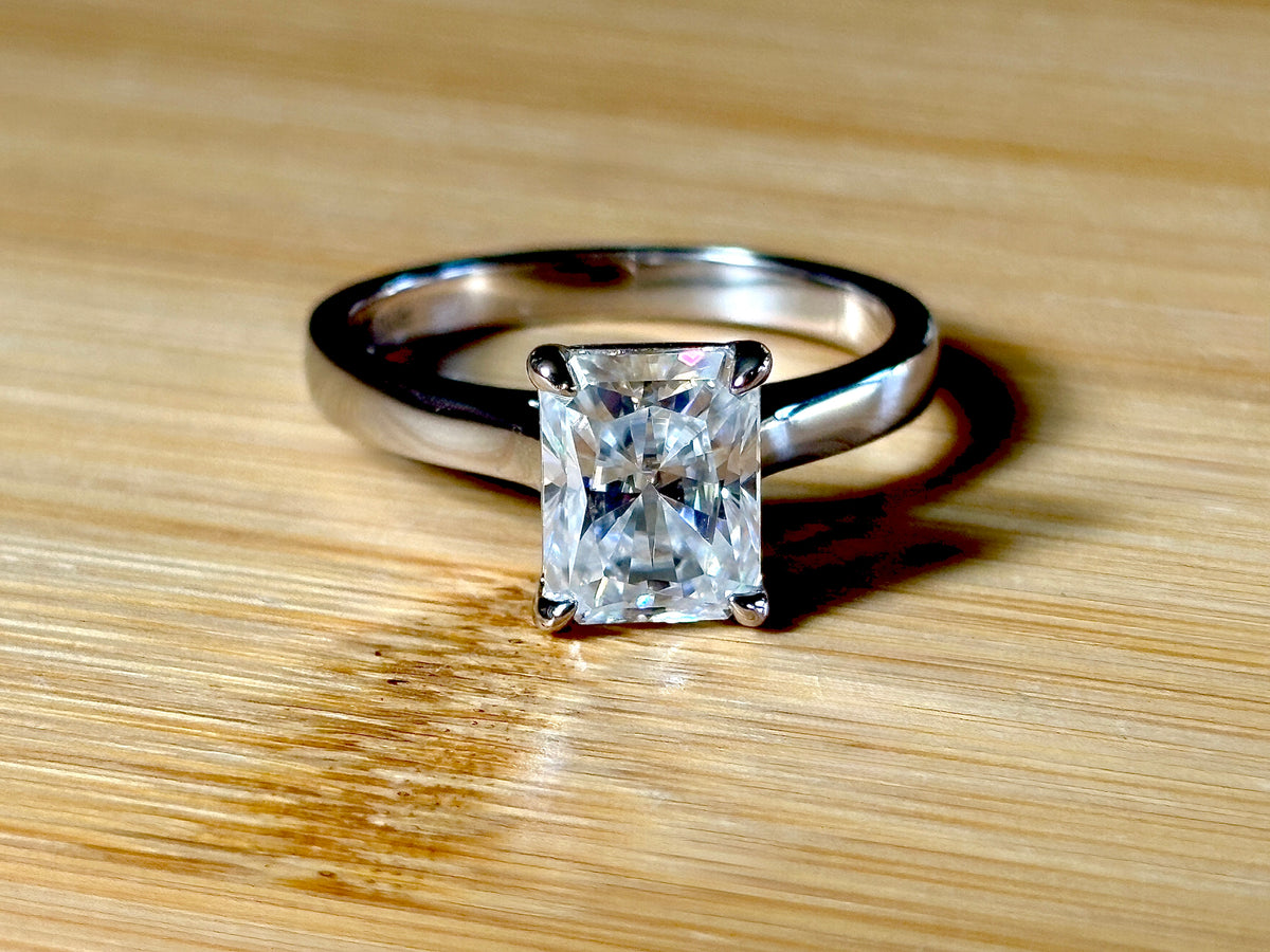 A certified Moissanite 3ct radiant solitaire! An UBER flashy, ULTRA classy, contemporary and chic radiant-cut engagement ring!