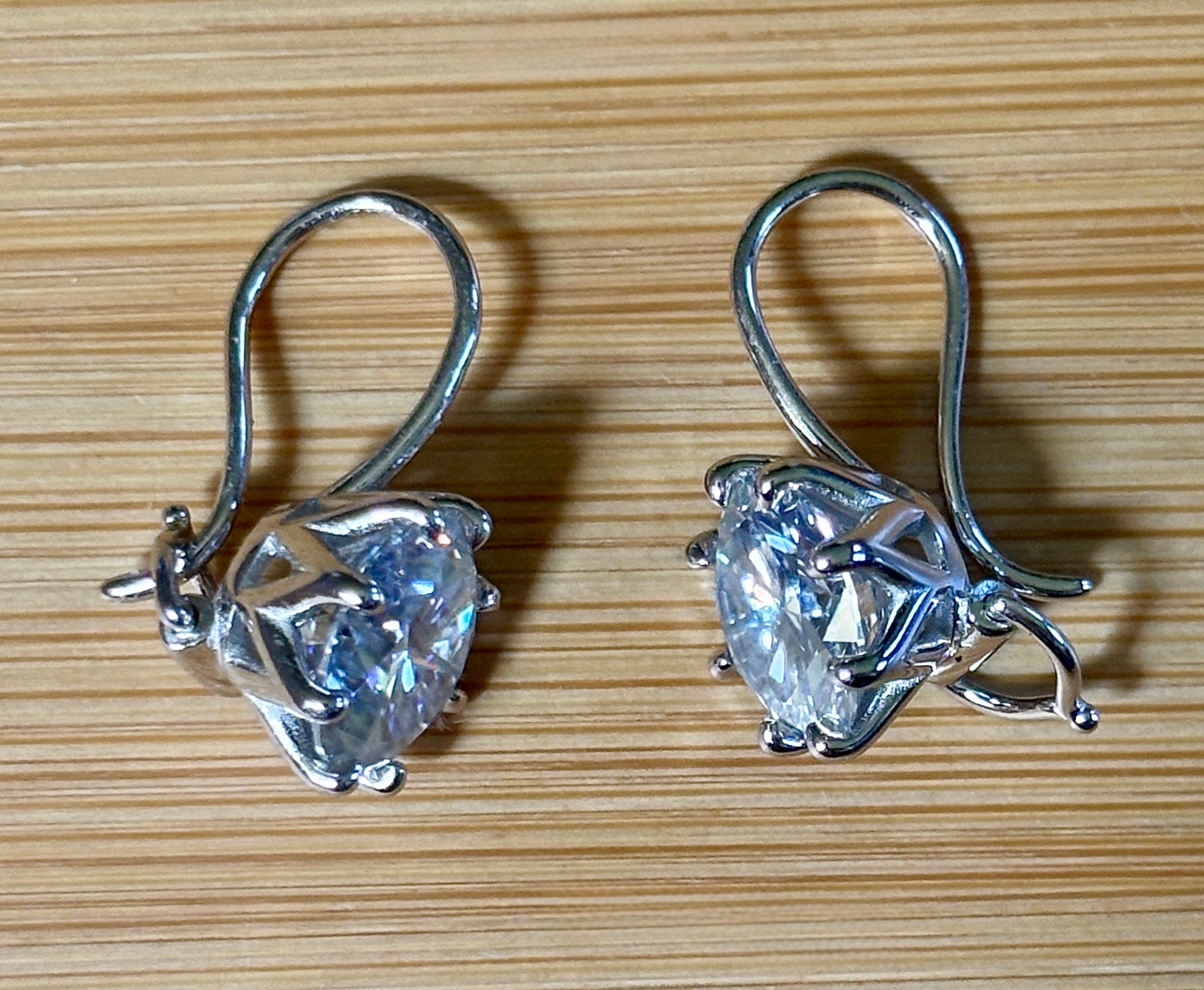 Moissanite earrings. Exclusive 8ctw double certified Moissanite fish hook earrings with *buckle backs* in 935 Argentium silver and 18k white rhodium!
