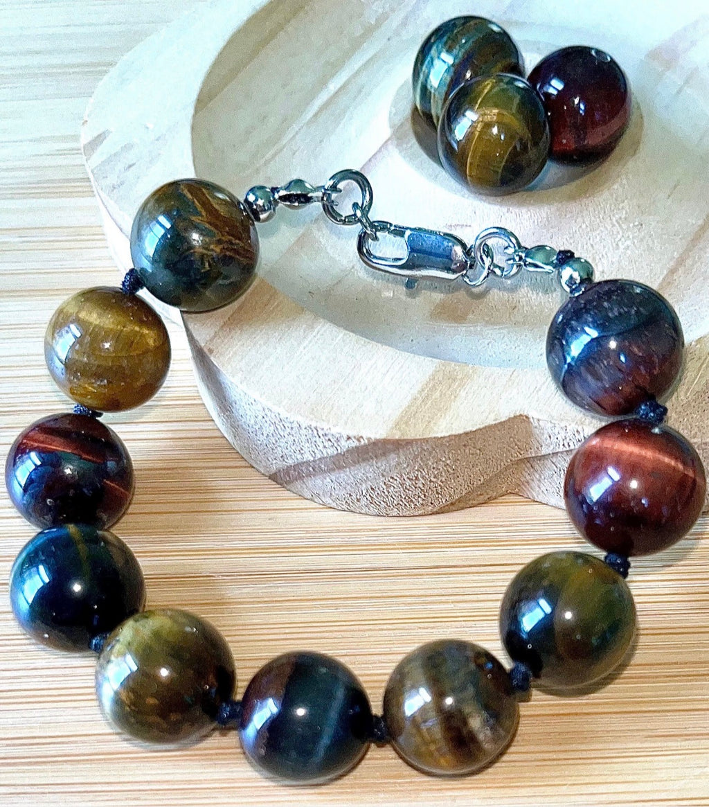 Tiger’s eye bracelet. 100% natural, highly chatoyant 14mm tricolored tiger’s eye hand knotted bracelet! Also available without the knots!