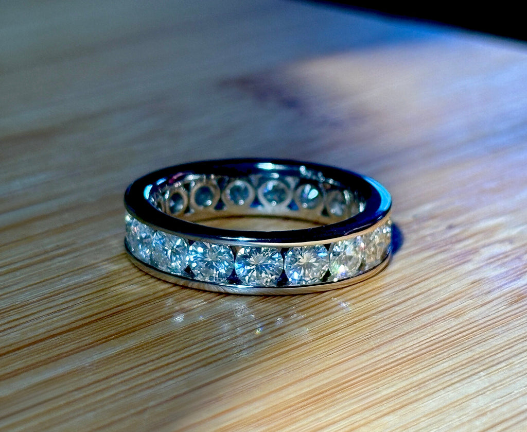 Moissanite ring. A 5.10cttw or 4.8cttw (depending on size) Moissanite eternity ring. A channel-set, classy and classic design - beautiful!