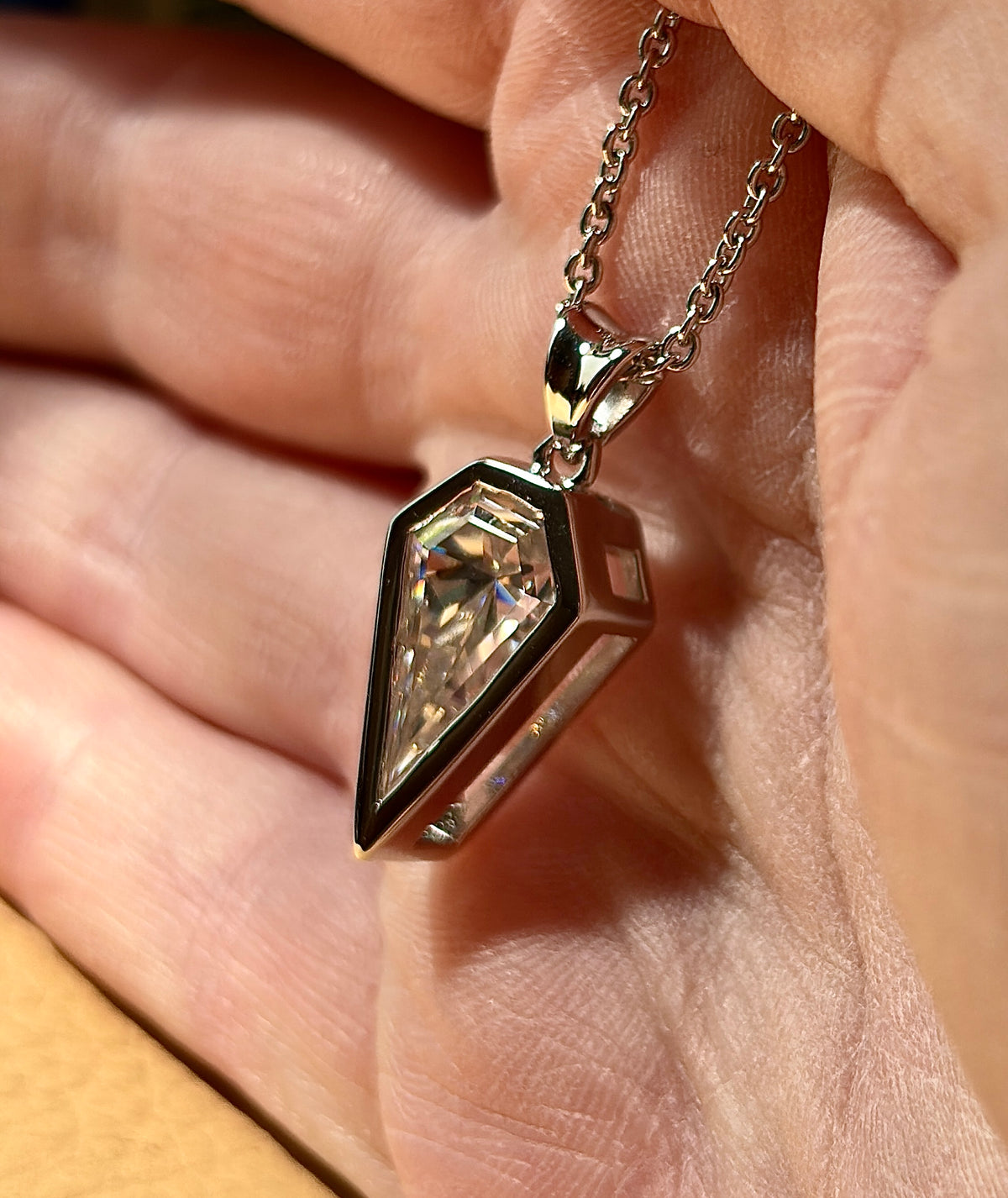 Moissanite necklace. “Flight!”, a kite-shaped, custom-cut 5ct Moissanite pendant! Hand-faceted by a master stone cutter and set in Argentium silver, it is suspended on a 20” sterling silver chain and is exclusive to Hand Knotted Jewelry!