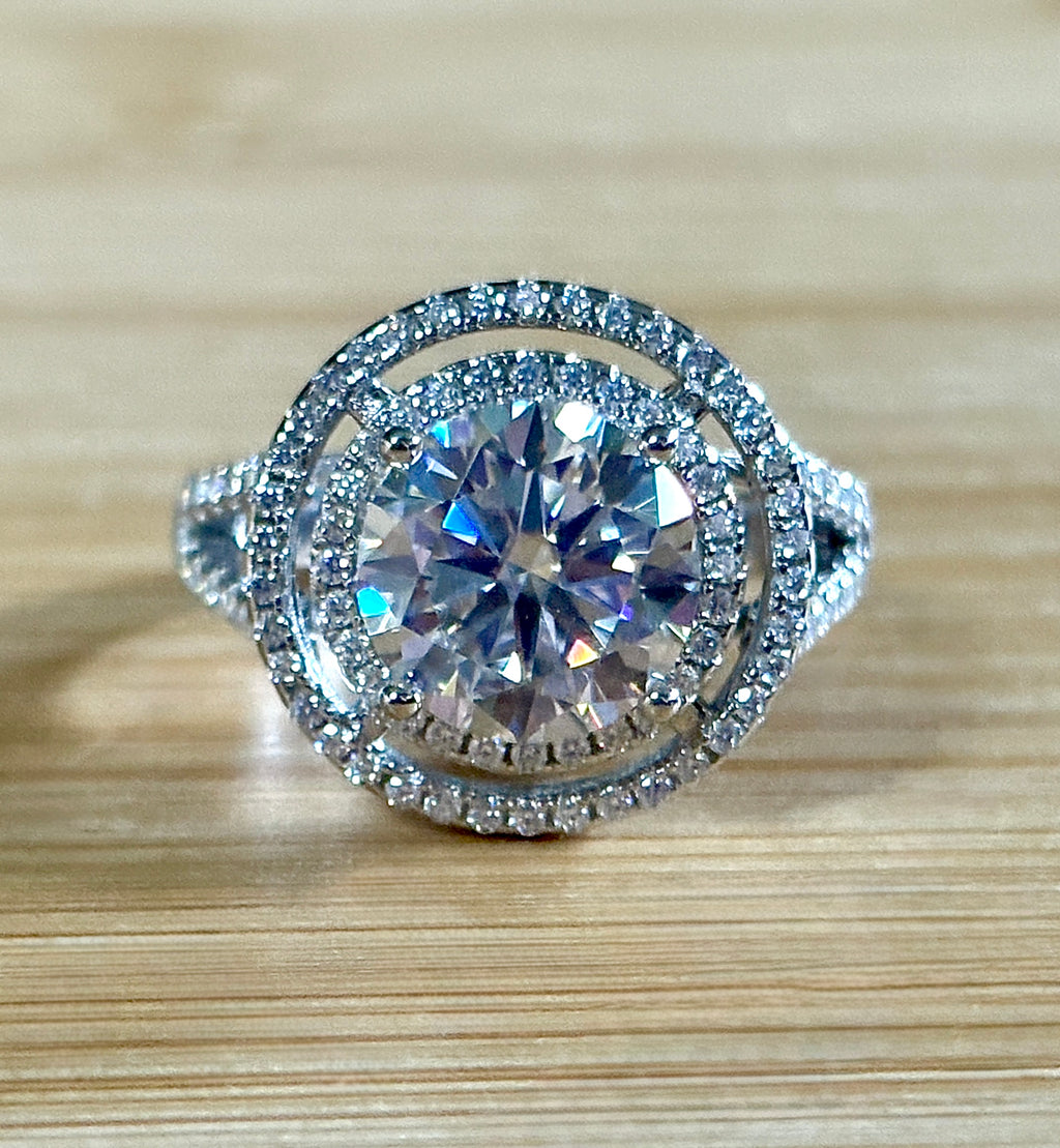 Moissanite ring. The 6.64cttw *fully* Moissanite “Bull’s Eye” ring, featuring a 4ct certified round brilliant Moissanite in a double halo!