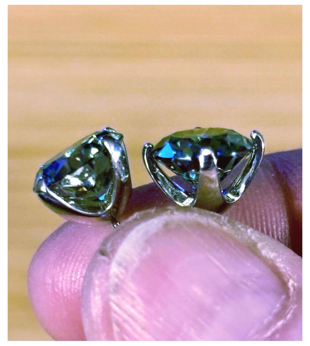 Moissanite studs. A 2cttw or 6cttw pair of cyan (greenish-blue) Moissanite studs. Double certified and rich in color, they are delicious!