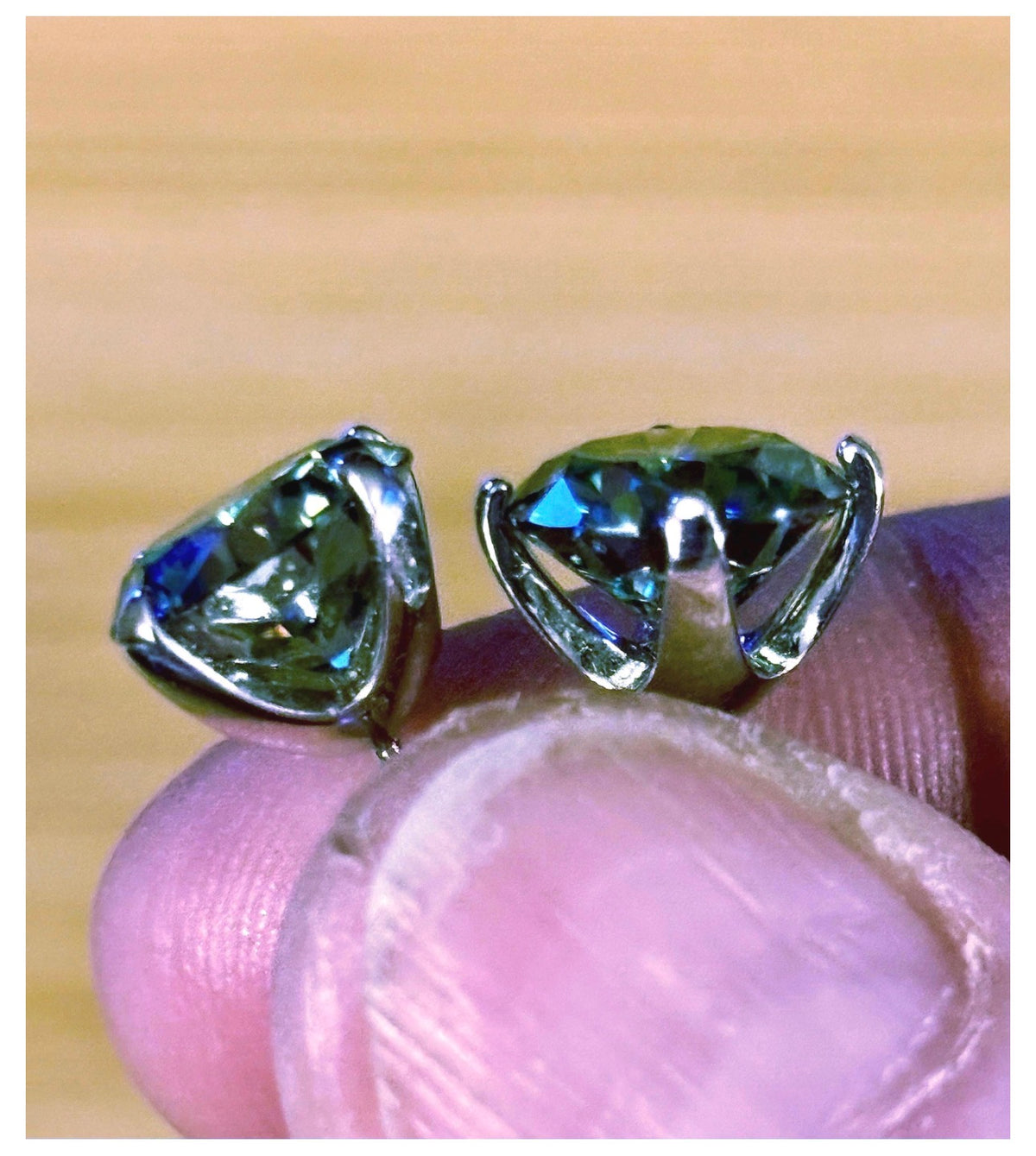 Moissanite studs. A 2cttw or 6cttw pair of cyan (greenish-blue) Moissanite studs. Double certified and rich in color, they are delicious!