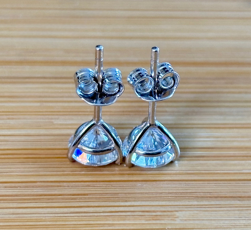 Moissanite studs. A 100-facet 2cttw pair of super bright, DOUBLE certified Moissanite studs in sterling silver and 18k white rhodium! Sublime!