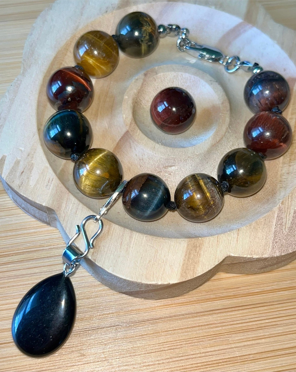 Tiger’s eye bracelet. 100% natural, highly chatoyant 14mm tricolored tiger’s eye hand knotted bracelet! Also available without the knots!