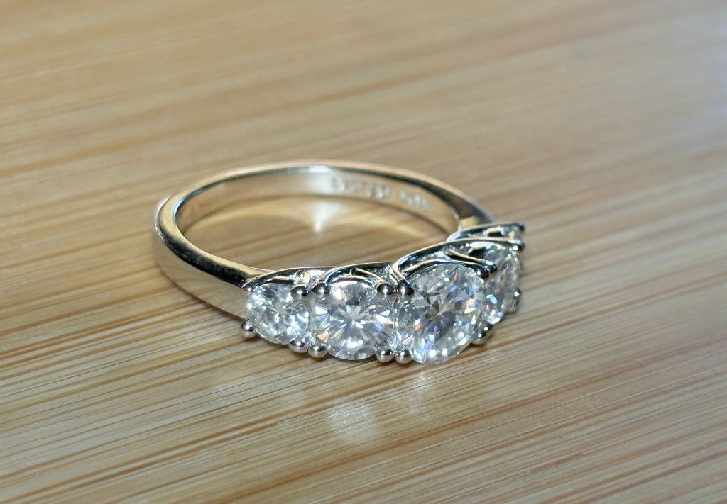 Moissanite ring. A 2.5ctw certified Moissanite ring, for those who want plenty of sparkle but a daintier ring! This feminine 5-stone design is just the thing!