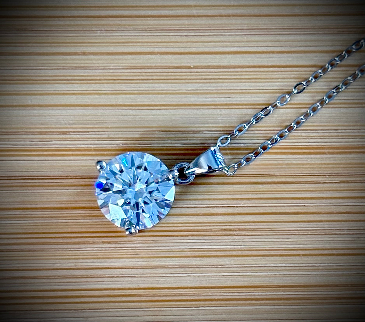 Moissanite necklace. A bright, white 3ct Moissanite solitaire in a minimalist sterling silver 3-prong mounting! Just gorgeous!